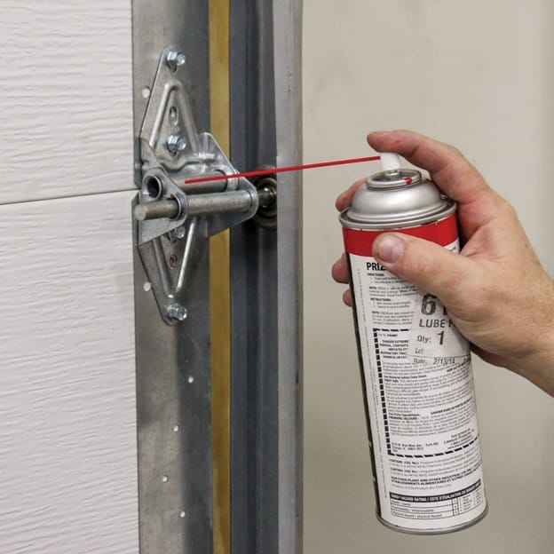 lubricating garage door rollers and hinges